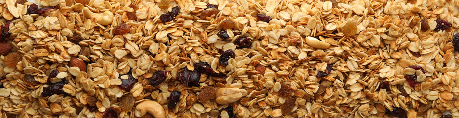 Granola with nuts and raisins on white background