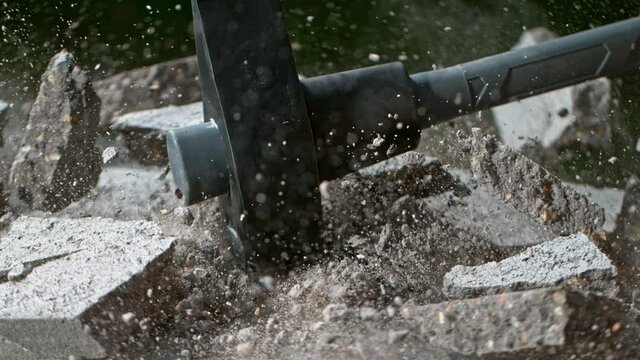 Super Slow Motion Shot of Smashing Concrete Brick with Sledgehammer at 1000fps.
