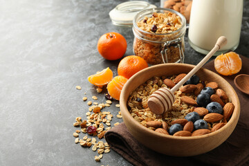 Concept of tasty breakfast with granola on black smokey background