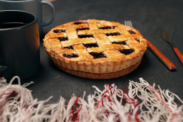 Berry tart pie on black table close up