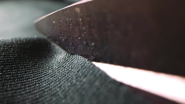 Cutting sheet of dark green fabric sew hockey club uniform