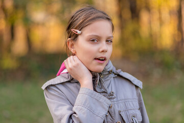 Portrait of a girl in the woods with a beautiful bokeh. 