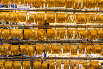 Golden jewelry at the gold street, also called Gold souk, in the city of Dubai, UAE