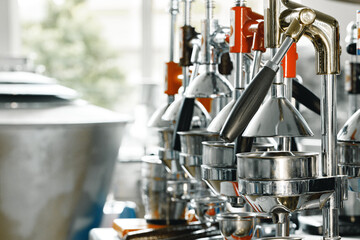 New metal manual juicers in a row on shop shelf