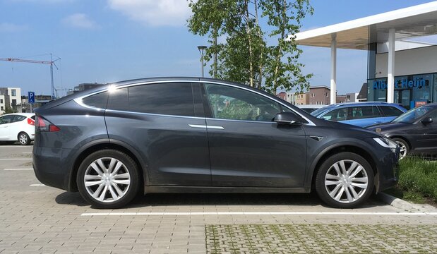 Almere, The Netherlands - May 6, 2017: Grey Tesla model X parked in a public parking lot. 
