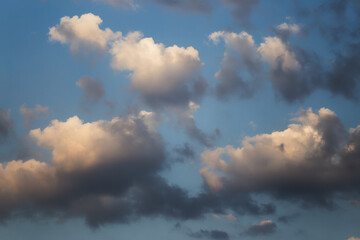 Fototapeta premium heavy clouds in the rays of the setting sun