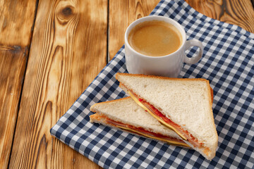 Triangle toasted sandwich on wooden board close up