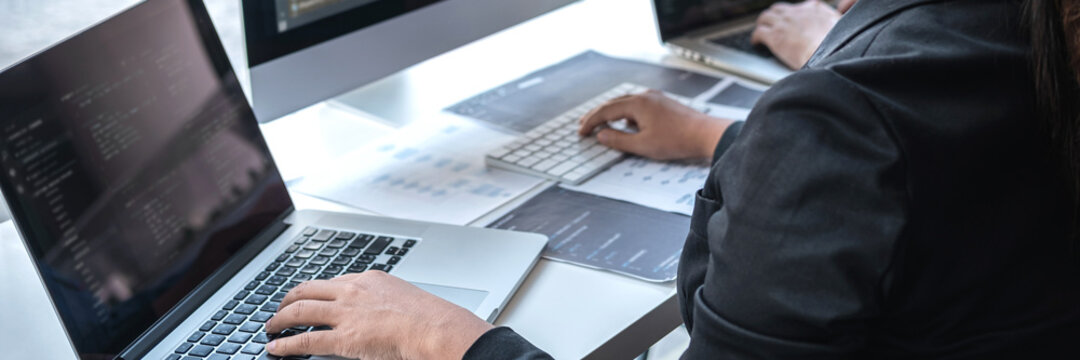 Team of Professional Developer programmer cooperation meeting and brainstorming and programming in website working a software and coding technology, writing codes and database