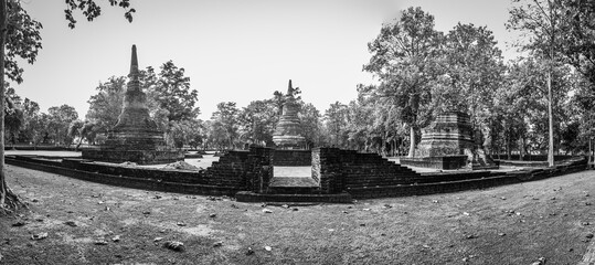 Landmark of old chedi made of ancient bricks in the Kamphaeng Phet Historical Park, Thailand. Black and white