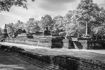 Landmark of Buddha image made of ancient bricks in the Kamphaeng Phet Historical Park, Thailand. Black and white