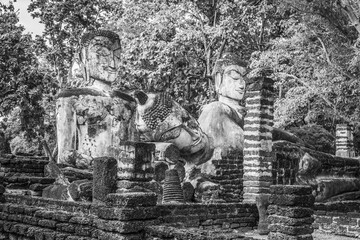 Fototapeta na wymiar Landmark of Buddha image made of ancient bricks in the Kamphaeng Phet Historical Park, Thailand. Black and white