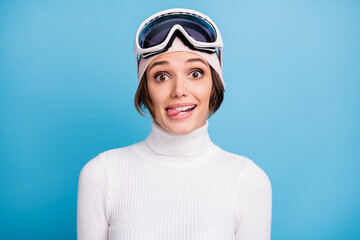 Photo of funky happy woman wear white turtleneck sportswear ski hobby weekend isolated on blue color background