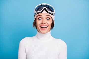 Photo of excited beautiful woman wear white turtleneck amazed discount ski gear isolated on blue...
