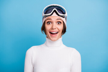 Photo of amazed young woman unexpected weekend in resort winter discount isolated on pastel blue color background