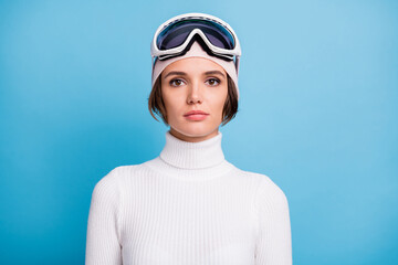 Photo of attractive serious sportive woman wear goggles mask turtleneck isolated on pastel blue color background