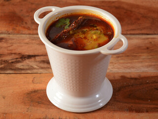 Authentic Indian popular food Dal Tadka Curry or Traditional Indian soup lentils on rustic wooden background. selective focus