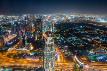 Night aerial view of Dubai from the top of  Burj Khalifa Tower in Dubai, United Arab Emirates, the tallest building in the world.
