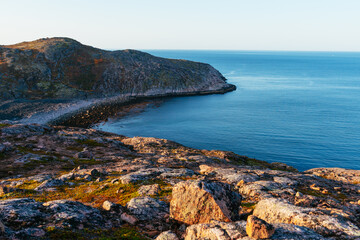 The rocky beach on the coast of the Barents Sea in the north of Russia.
Russian polar region, Kola Peninsula, overlooking the Barents sea the Arctic ocean, Murmansk oblast