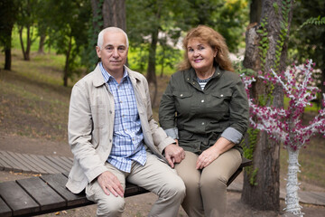 Fototapeta premium Happy senior couple looking on each other. Beautiful love relation and care of retirement old people.