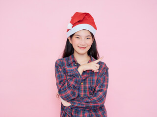 Teenage girl wearing Santa Claus hat
