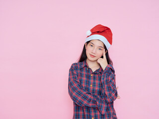 teenage girl wearing santa hat