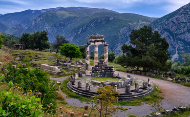 Ruins of Tholos of ancient Greek goddess Athena Pronaia in Delphi, Greece. UNESCO World heritage...