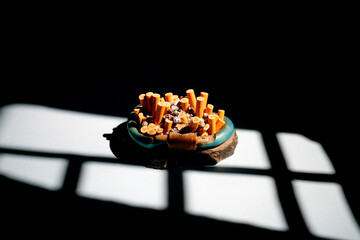 ashtray full of cigarette butt