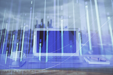 Forex Chart hologram on table with computer background. Multi exposure. Concept of financial markets.