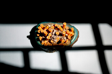 ashtray full of cigarette butt