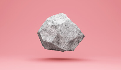 Floating stone on pink studio background