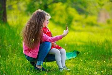 mom and daughter take a selfie