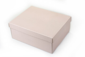 Empty pink paper box with a lid on a white