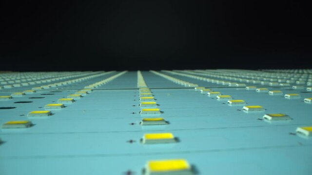 Factory of create disassembled LED lamp. Many Light-emitting diode panels with black surface. Macro shot. Industry of new technology and energy saving. Concept.