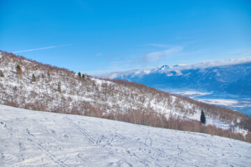 Winter landscape high in the mountains with blue sky