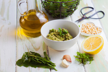 Wild herbs pesto close up in the bowl