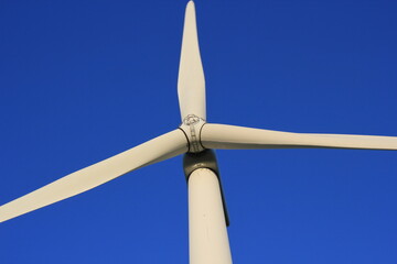 Wind farm turbines that produce electricity energy. Windmill Wind power technology productions Wind...
