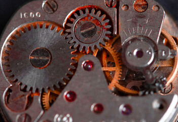 Old clockwork mechanism in close-up. Selective focus on macro details. Light vintage toning. Grunge...