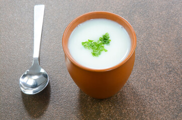Buttermilk in a pot cup garnished with parsley