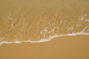 Fototapeta na wymiar soft wave on the beach in the sea
