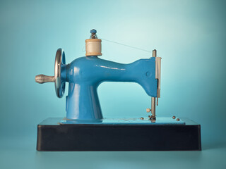 Sewing machine on blue background