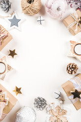 Festive Christmas background with different size gift boxes and Christmas decorations. Top view. Copy space for text.