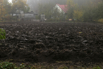 plowed vegetable garden near the house