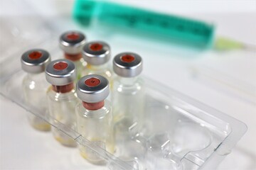 syringe and vials of medicine