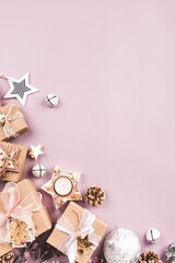 Festive Christmas background with different size gift boxes and Christmas decorations. Top view. Copy space for text.