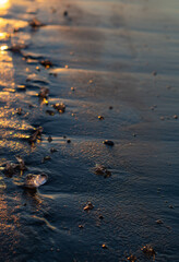 the frozen Bank of the river at sunset.Sand and ice