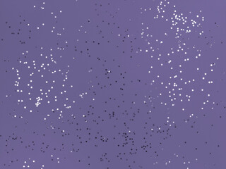 Confetti stars sparkling on lavender color background.