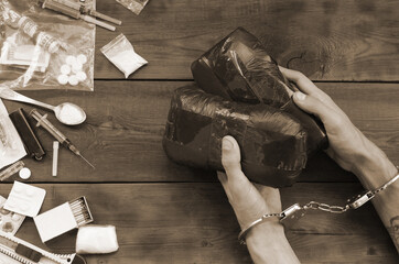Drug trafficker arrested with their heroin packages. Police arrest drug dealer with handcuffs and...