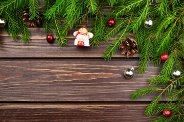Winter holidays background with fir tree branches and christmas decorations