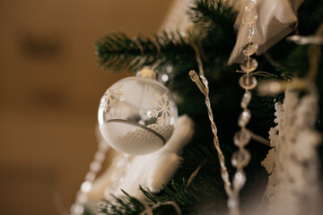 Christmas tree decoration: Christmas glass toys, flickering garlands. concept: an example of the...