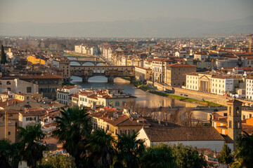 Fototapeta na wymiar Florence at sunset with Arno river and Ponte Vecchio
